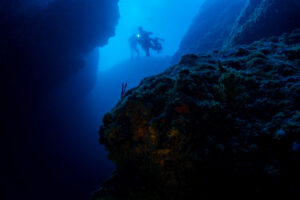 Divers in an underwater canyon in Croatia Rab Island