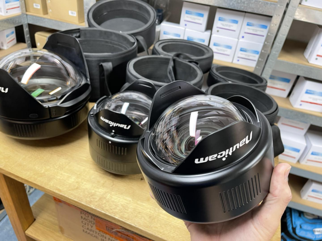 Lenses for Underwater Photography featuring various underwater lenses on display, showcasing wide-angle and macro types essential for capturing detailed and clear underwater scenes.