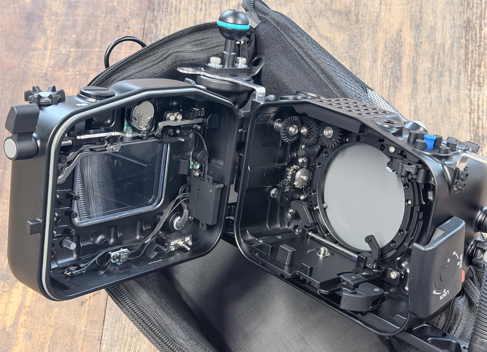 Open Nauticam NA-FX5 housing showing the internal mechanical controls and port opening