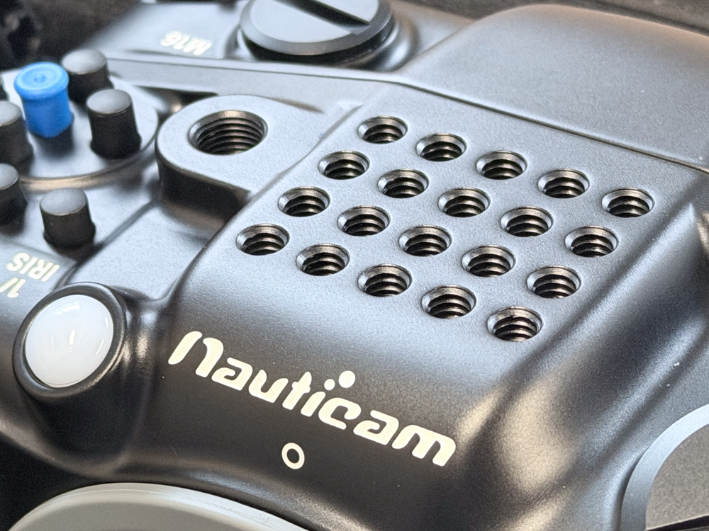 Close-up of multiple threaded accessory mounting points on top of the Nauticam NA-FX5 housing