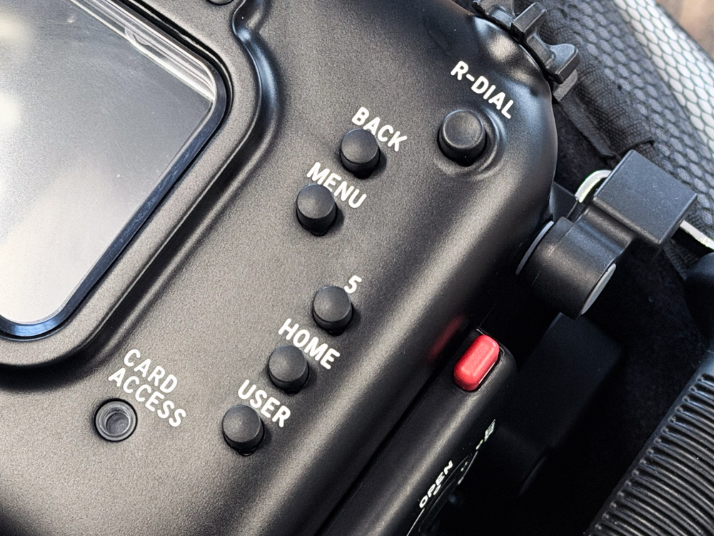 Close-up of the Back, Menu, Home, User and rear dial controls on the Nauticam NA-FX5 housing