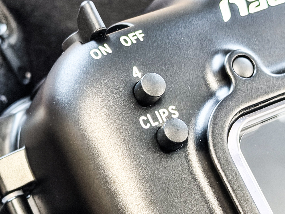 Close-up of the dedicated CLIPS button on the Nauticam NA-FX5 underwater housing
