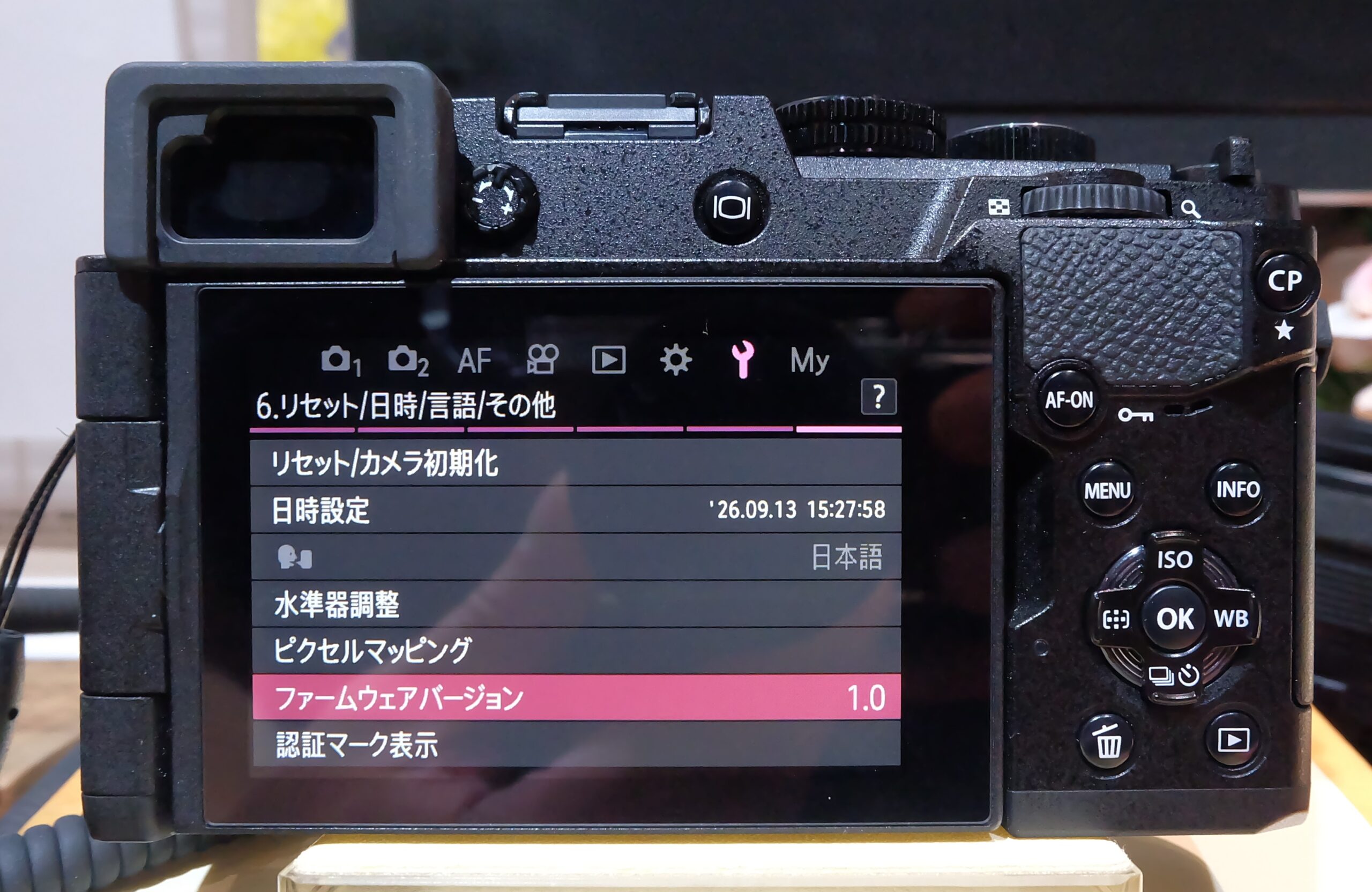 Detailed rear view of OM SYSTEM PEN 2026 showing AF-ON, CP, menu and directional controls