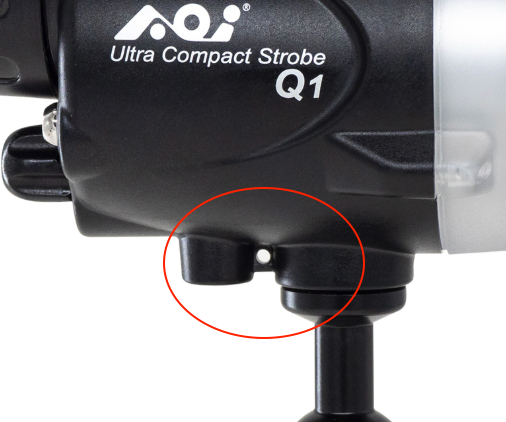 Safety eye on an underwater strobe for attaching a lanyard